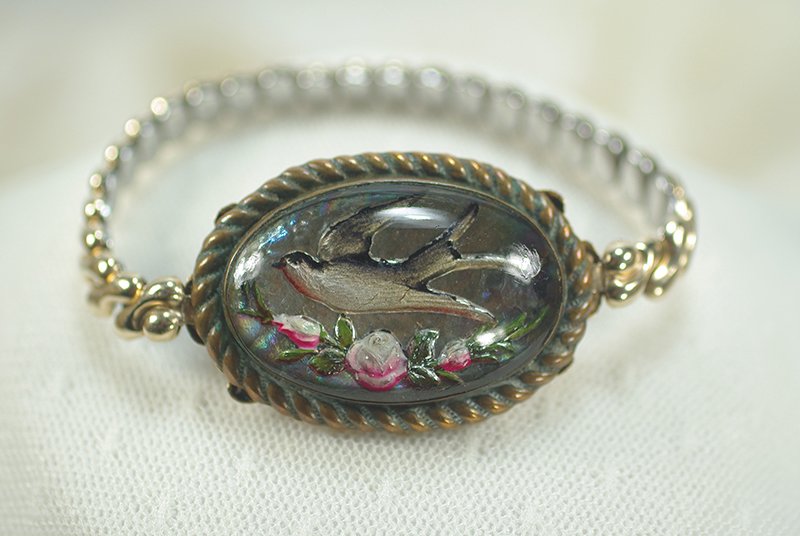 sreversecarvedandpaintedbirdfloralbracelet.jpg